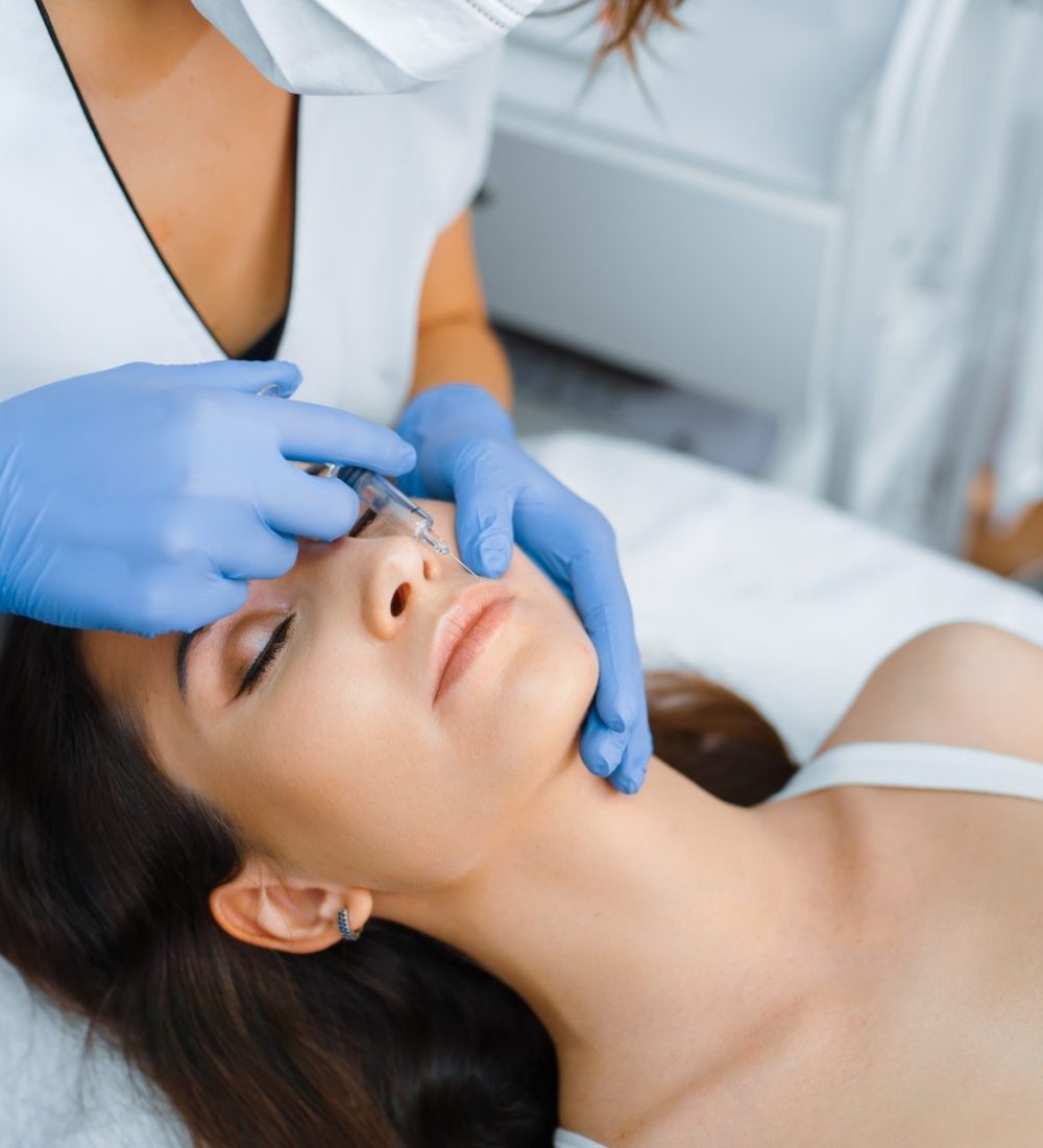 cosmetician-gives-face-botox-injections-to-patient.jpg cosmetician-gives-face-botox-injections-to-patient.jpg